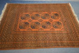 A HAND WOVEN NAHZAT RUSSET GROUND RUG, 250cm x 166cm