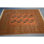 A HAND WOVEN NAHZAT RUSSET GROUND RUG, 250cm x 166cm