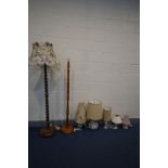 SEVEN VARIOUS LAMPS, to include an oak barley twist standard lamp, another oak standard lamp, four