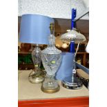 THREE ELECTRIC LAMPS, comprising a cut glass urn shaped table lamp with blue shade, height