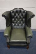 A GREEN LEATHER BUTTON BACK WINGBACK CHAIR on cabriole legs, width 90cm x depth 87cm x height