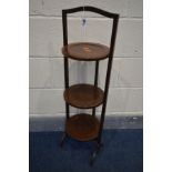 AN EDWARDIAN MAHOGANY AND INLAID THREE TIER FOLDING CAKE STAND