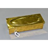 A WMF BRASS AND WOOD CIGARETTE BOX, Circa 1910, the hinged lid has a planished, oval panel, the