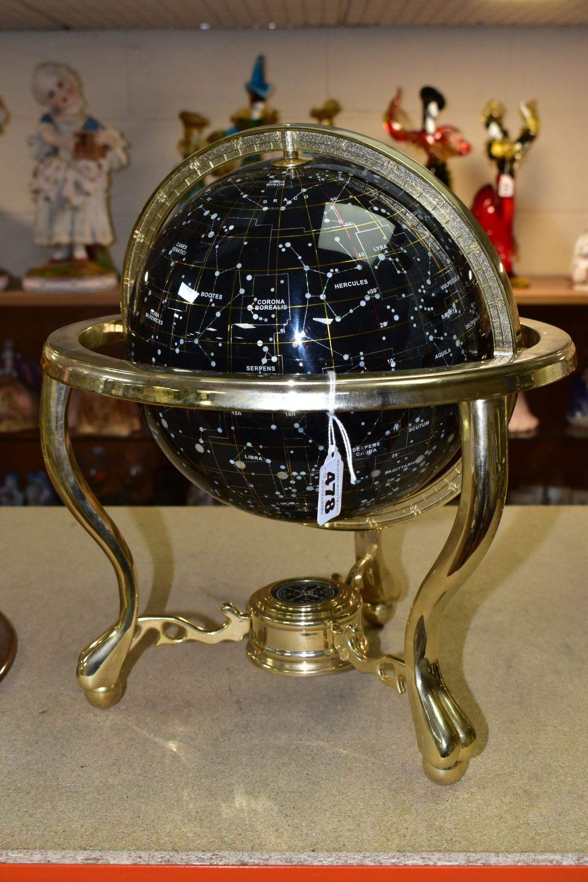 A BOXED GUILDFORD ASTRONOMICAL SOCIETY CELESTIAL GLOBE, supported by a brass metal stand inset