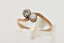 A 9CT GOLD CUBIC ZIRCONIA RING, of a cross over design, set with two colourless circular cut cubic