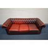 A BURGUNDY LEATHER CHESTERFIELD SOFA, Length 198cm (condition - cushions worn and cracking, but no