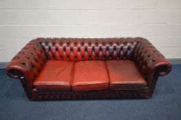 A BURGUNDY LEATHER CHESTERFIELD SOFA, Length 198cm (condition - cushions worn and cracking, but no