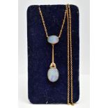 A YELLOW METAL OPAL PENDANT NECKLACE, the pendant designed with an oval cut opal within a milgrain