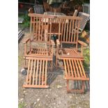 A PAIR OF MODERN FOLDING HARDWOOD STEAMER CHAIRS with footrests and brass fittings (2)