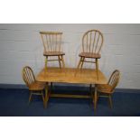 AN ERCOL BLONDE ELM AND BEECH RECTANGULAR TABLE, on splayed legs united by a single stretcher, width