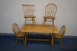 AN ERCOL BLONDE ELM AND BEECH RECTANGULAR TABLE, on splayed legs united by a single stretcher, width