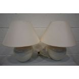 A PAIR OF CREAM CERAMIC TABLE LAMPS with shades