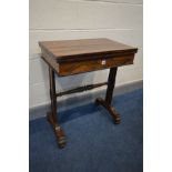 A REGENCY ROSEWOOD CARD TABLE, the fold over top enclosing an oval baize playing surface, single
