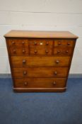 A VICTORIAN WALNUT CHEST OF EIGHT ASSORTED DRAWERS, with turned handles, width 118cm x depth 52cm