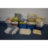 A COLLECTION OF CUSHIONS in various styles, sizes and colours together with two throws and a table