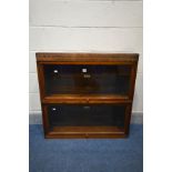 A GLOBE WERNICKE AND CO OAK TWO SECTION BOOKCASE, with glazed fall front doors, width 85cm x depth