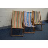 A SET OF THREE 1970'S FOLDING DECK CHAIRS with stripped fabric