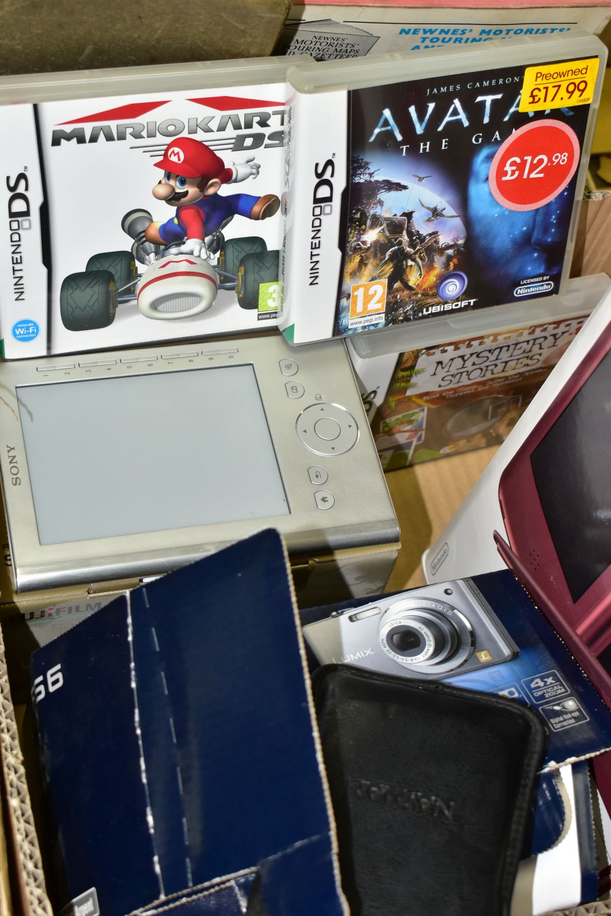GAMING AND CAMERAS ETC, comprising a Nintendo DS XL with case and box, wine red, three DS games,