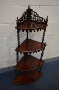A VICTORIAN ROSEWOOD FOUR TIER WHAT NOT, raised pierced back, barley twist supports, finials and