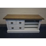 A PARTIALLY PAINTED AND HARDWOOD TOPPED TV STAND with three drawers and open shelves, width 120cm