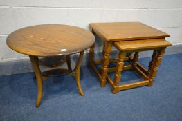 AN ERCOL GOLDEN DAWN CIRCULAR OCCASIONAL TABLE with a glass undershelf, diameter 60cm x height