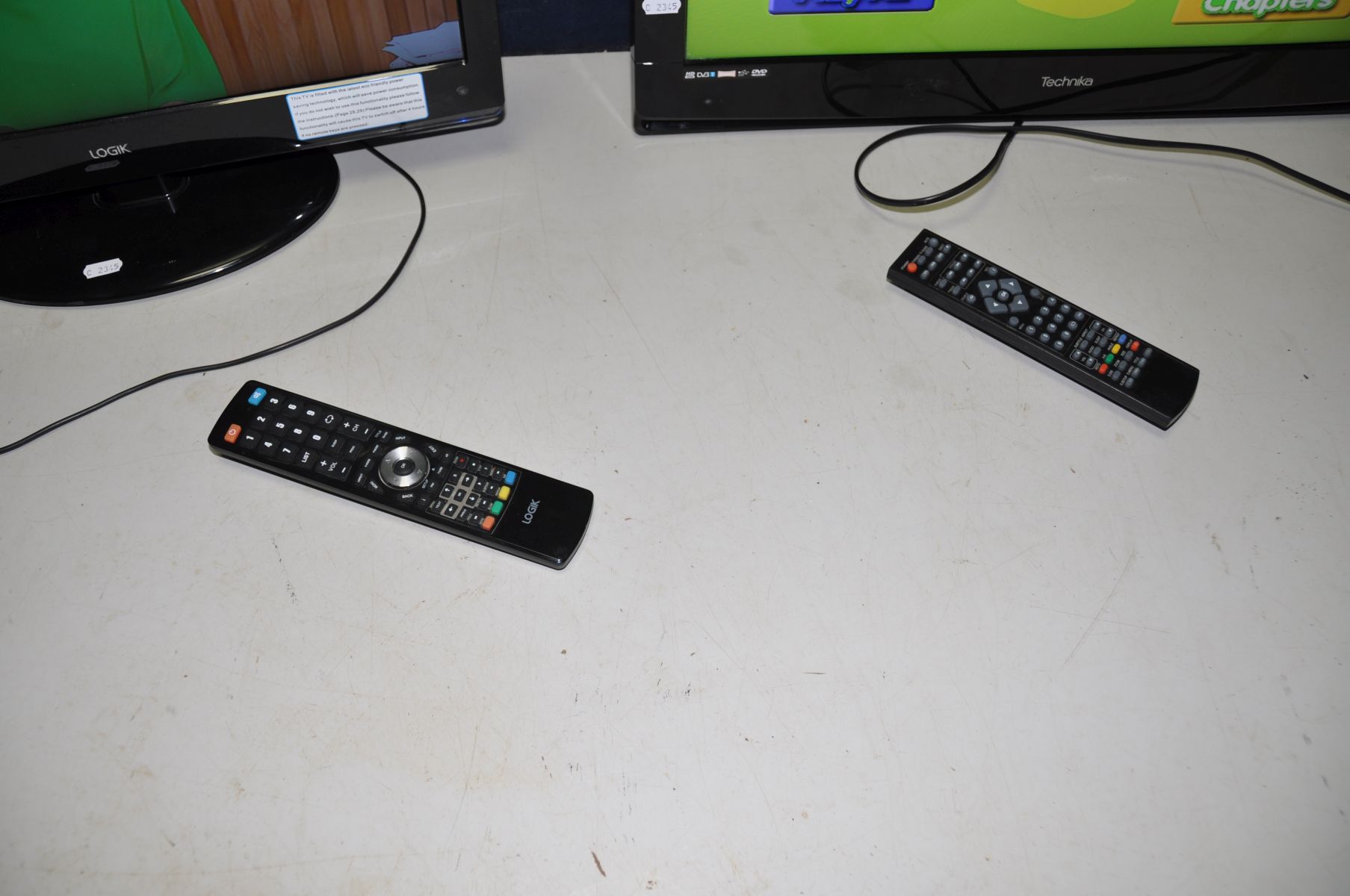 A TECHNIKA 26in TV DVD COMBI with remote ( no stand) and a Logik 22in TV DVD combi with remote ( - Image 2 of 3