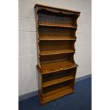 AN ERCOL GOLDEN DAWN ELM OPEN BOOKCASE, width 93cm x depth 36cm x height 193cm