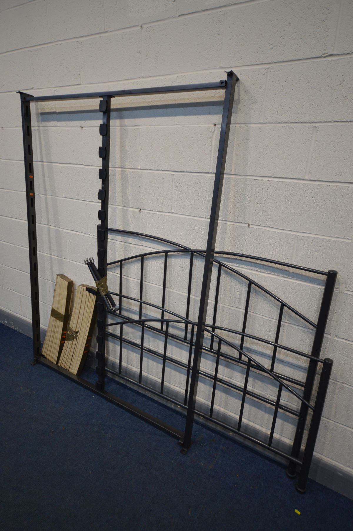 A MODERN METAL 4FT6 BEDSTEAD