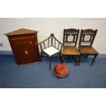 A PAIR OF EDWARDIAN OAK CHAIRS, with spindles below arched top rail, square ceramic panel to