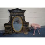 A DISTRESSED CAST IRON OVERMANTEL MIRROR, overpainted gilt and black, oval mirror, 120cm x 100cm (