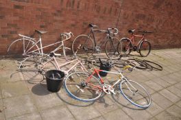 A COLLECTION OF VINTAGE BIKES AND PARTS including two Raleigh Ladies racing bike frames, an Apollo