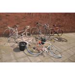 A COLLECTION OF VINTAGE BIKES AND PARTS including two Raleigh Ladies racing bike frames, an Apollo