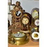A GROUP OF EIGHT CLOCKS AND A REPRODUCTION GILT BRASS MANTEL CLOCK CASE, including three anniversary