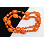 AN AMBER COLOURED BAKELITE BEAD NECKLACE, designed with thirteen large oval beads each measuring