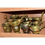 TWELVE ASSORTED BRASS PESTLES AND MORTARS, one in bronze/gun metal, various designs, tallest 15cm,