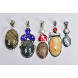 FIVE WHITE METAL GEM SET PENDANTS, large pendants set with a variety of semi-precious stones such as