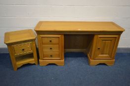 A SOLID OAK FRENCH STYLE DRESSING TABLE, with three drawers and a single door cupboard, width