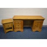 A SOLID OAK FRENCH STYLE DRESSING TABLE, with three drawers and a single door cupboard, width