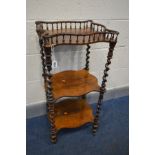 A VICTORIAN ROSEWOOD THREE TIER WHAT NOT, wavy design, spindled gallery, each tier joined by