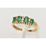 A YELLOW METAL EMERALD AND DIAMOND HALF ETERNITY RING, designed with a row of four marquise cut