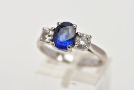 AN 18CT WHITE GOLD SAPPHIRE AND DIAMOND RING, designed with a four-claw set, oval cut blue sapphire,