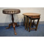 A REPRODUCTION MAHOGANY CIRCULAR WINE TABLE with a spindled gallery and an oval mahogany nest of