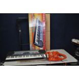 A FLYMO EASICUT 450 ELECTRIC HEDGE TRIMMER and a Casio CTK 471 electronic keyboard with box, power