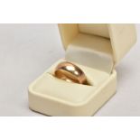 A 9CT YELLOW GOLD WIDE BAND RING, plain polished design, approximate width 7.6mm, hallmarked 9ct