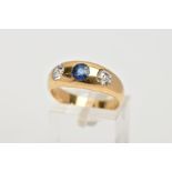 AN EARLY 20TH CENTURY 18CT GOLD DIAMOND AND SAPPHIRE RING, the tapered band plush set with a central