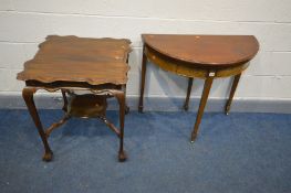 AN EDWARDIAN MAHOGANY DEMI LUNE TEA TABLE, the fold over top enclosing a green baize lining, on