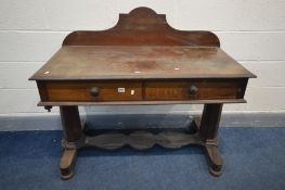 A VICTORIAN FLAME MAHOGANY WASHSTAND, with a shaped raised back, two frieze drawers, on tapered