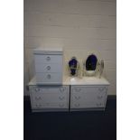 A PAIR OF WHITE FRENCH STYLE CHEST OF THREE DRAWERS, a three drawer bedside cabinet and a triple