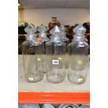 SIX HAND BLOWN GLASS STORAGE BOTTLES WITH CUT GLASS STOPPERS, height approximately 32cm, bottles are