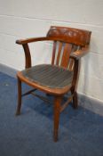 AN 1940'S OAK OFFICE ARMCHAIR